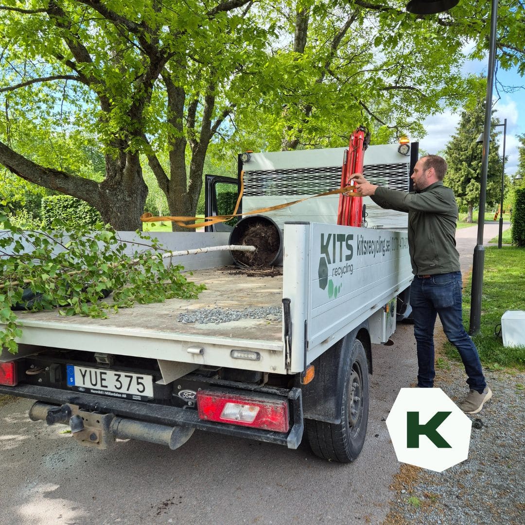 a man standing on the back of a truck